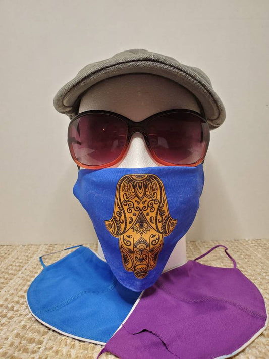 Hamsa face Cover , on Israeli blue background, metallic gold printed design, pocket filter face mask, adjustable ear straps with clips